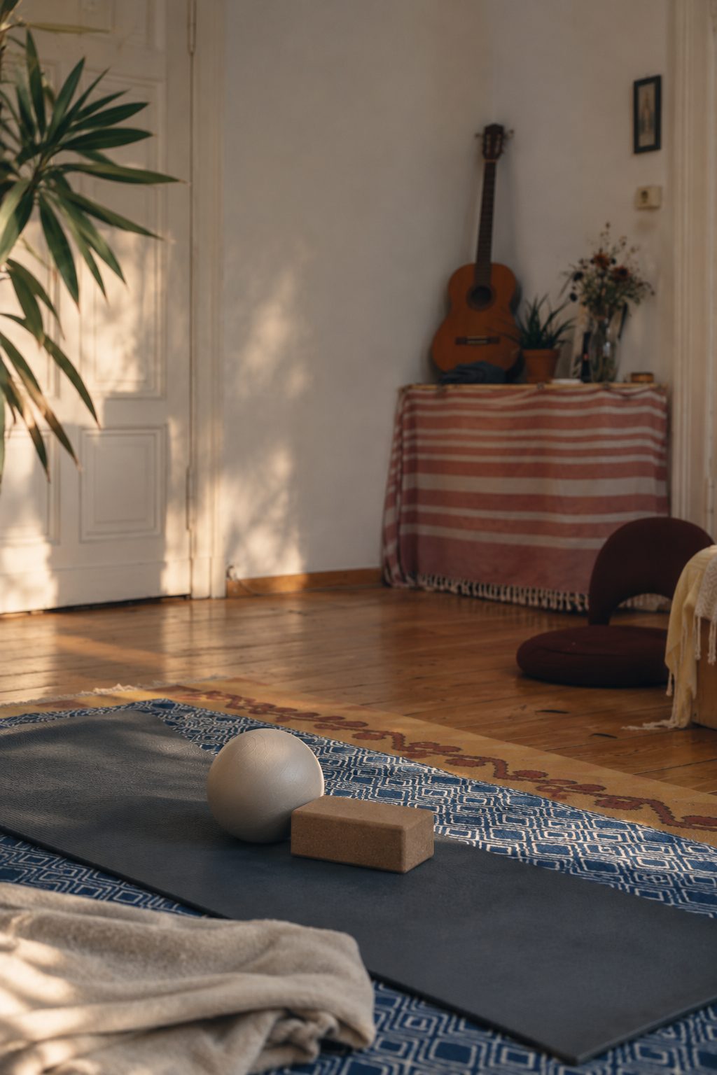 Pilates mat with ball and cork block in the practice room